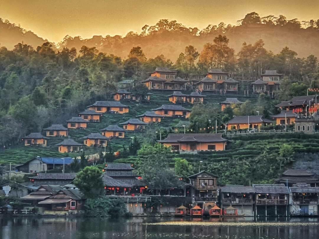 Rak Thai Village in the embrace of the mountain